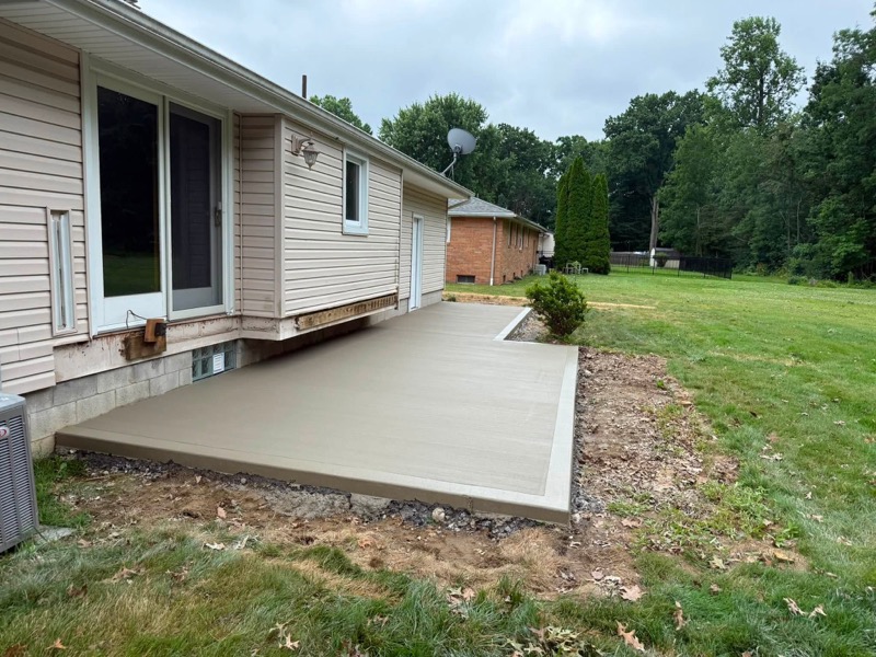 Concrete patio extension and walkway