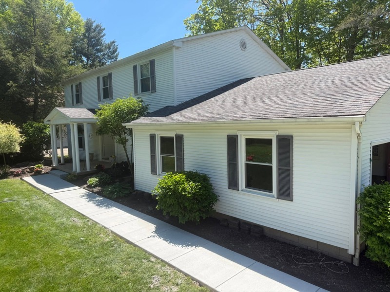 Concrete sidewalk along residential home